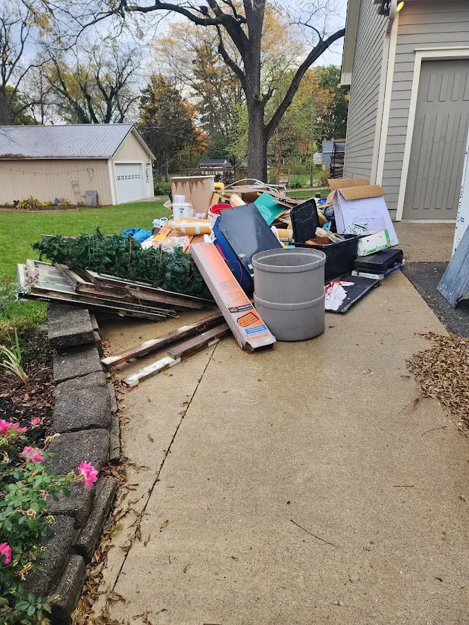 Dumpster being loaded with debris for Estate Cleanout Dumpster Rental in Chanceford